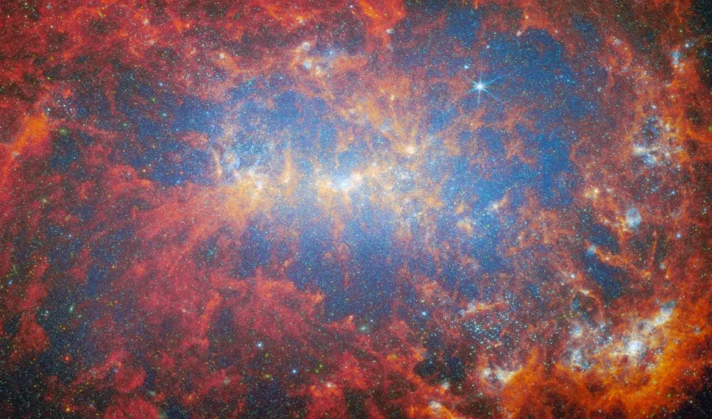 La galassia nana NGC 4449, una potente fucina di stelle osservata da Hubble nella costellazione dei Cani da Caccia